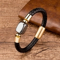 Close-up of woven black leather bracelet with gold clasp and grey square metal charm - Dark Gray Square Metal / Gold