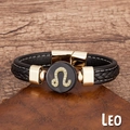 Détail du bracelet en cuir tressé noir avec charme Lion doré et fermoir magnétique solide - Lion