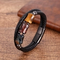 Close-up of men's multi-layer woven leather bracelet with tiger eye stones and magnetic clasp - Blue Tiger Eye Stone