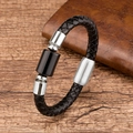 Close-up of black braided leather bracelet with stainless steel clasp and black stone bead - Black Cylindrical Accessory / Silver