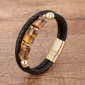 Detailed macro of layered leather bracelet featuring tiger eye stones and gold magnetic clasp - Gold-D