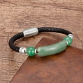 Close-up of woven black leather bracelet with green stone beads and magnetic metal clasp - Silver-Aventurine