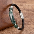 Close-up of woven leather bracelet with green natural stone and magnetic clasp - Silver-Green Stone