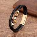 Détail du bracelet en cuir tressé noir avec perles oeil de tigre et fermoir magnétique doré - Style Oeil de Tigre Doré