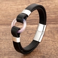 Detail view of black double leather bracelet with pink resin ring and magnetic silver clasp - Silver-F (Pink Translucent Ring)
