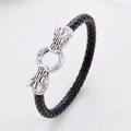 Dettaglio del bracciale in pelle nera intrecciata con chiusura a testa di drago d'argento - Testa di Drago d'Argento Vintage (Stile 5)