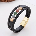 Macro detail of men's leather bracelet with tricolor stone beads and gold magnetic clasp - Three-color Stone Style