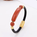 Detail of black braided leather bracelet with red jasper stone and golden magnetic clasp - Red Jasper Gold Clasp Style