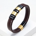 Detailed side view of braided brown leather bracelet with gold and black metal rings - Brown Leather Gold Gunmetal Ring (Brown-2)