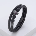 Macro detail of men's leather skull bracelet with red rhinestone eyes and magnetic clasp - Gunmetal Skull Lava Stone (Black-5)