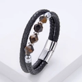 Detailed macro view of black braided leather bracelet with tiger eye stones and metal clasp - Silver (Brown Tiger Eye)