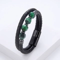 Detail of men's braided black leather bracelet with green gemstones and magnetic clasp - Black (Green Ore Bead)
