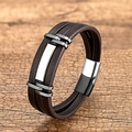 Mehrlagiges geflochtenes Lederarmband für Herren mit Edelstahl-Magnetverschluss auf Holz - Schwarz-Silber & Braunes Leder