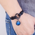 Close-up of Virgo leather bracelet featuring a blue galaxy zodiac charm on a black strap - Virgo (Gold)