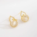 Luxurious gold cat-eye stone gourd earrings with micro-set zircons on white background - Gold