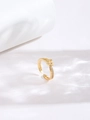 Macro detail of gold knot ring featuring sparkling zircon pavé and adjustable open band - Adjustable Open / Gold