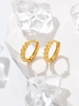 Close-up of gold-plated bamboo heart huggie earrings on a white stone base - Real Gold / Six Linked Hearts Hoop Earrings