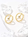 Macro view of gold plated bamboo geometric earrings with clear zircon on stone background - Real Gold / Round Rhinestone Stud Earrings