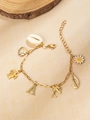 Gouden oceaan bedelarmband met zeeschildpad, dolfijn, madeliefje en letter A hanger - Letter A