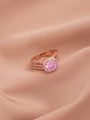 Detailed macro of a rose gold triple-layered ring with a large pink zircon center stone - US 9 / Rose Gold Plated Pink Zirconia