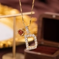 Luxury gold letter D pendant necklace with sparkling white zircons and a small red heart charm - Letter D