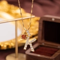 Gold plated letter K necklace with sparkling crystals and a red apple pendant - Letter K