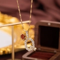 Golden bamboo chain necklace with crystal-paved letter pendant and red heart gem - Letter Q