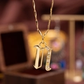 Gothic letter 'n' pendant necklace with gold plating and sparkling zircon stones - Letter N