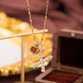 Gold bamboo chain necklace with red apple pendant and shimmering crystal X charm - Letter X