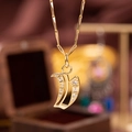 Gold plated letter necklace with sparkling zircons and delicate melon seed chain - Letter V