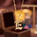 Elegant gold letter E pendant necklace with clear cubic zirconia and bamboo style chain - Letter E