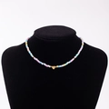 Rainbow macaron beaded necklace with a golden heart pendant featuring initial A - Letter A