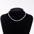 Colorful macaron bead necklace featuring a gold heart pendant with letter G engraving - Letter G