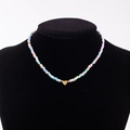 Rainbow macaron beaded necklace with heart-shaped gold letter K pendant detail - Letter K