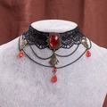Gothic black lace choker featuring a large red oval ruby and bronze metal details - Black Lace Red Rhinestone Tassel Style