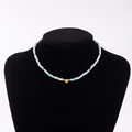 Rainbow macaron beaded necklace with a golden heart pendant featuring letter P - Letter P