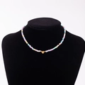 Rainbow macaron bead necklace with gold heart pendant featuring the letter S - Letter S