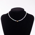 Rainbow macaron beaded necklace with a golden heart pendant featuring letter T - Letter T