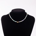 Rainbow seed bead necklace with gold heart charm featuring engraved letter V - Letter V