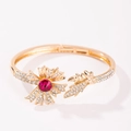 Elegant gold open flower bracelet featuring pink center stone and white rhinestones - Red Flower Bracelet
