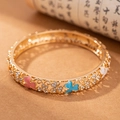 Vintage golden cloisonné clover bangle with pink and blue enamel and sparkling crystals - Clover