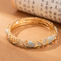 Bracciale vintage in lega dorata con quadrifoglio ciano, farfalle e zirconi - Trifoglio Blu