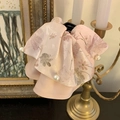 Detailed shot of a large pink floral hair claw clip featuring elegant white pearl accents - Pink Hair Claw