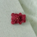 Detail of red acetate bear hair clip with glitter finish and a cute bow tie accent - Red