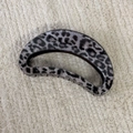 Detail view of a grey leopard print hair claw clip on a soft textured background - Gray Leopard-Hollow Semicircle