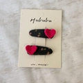 Close-up of black floral fabric hair clips with 3D pink velvet hearts on display card - Fuchsia Heart Clips