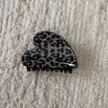 Detail view of heart-shaped leopard print hair claw clip on soft knitted background - Gray Leopard-Heart
