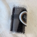 Detail of durable black braided hair ties set in a clear cylinder storage container - Braided Black Set