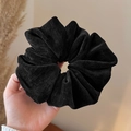 Close-up of a large black corduroy scrunchie with soft ribbed texture and high elasticity - Black