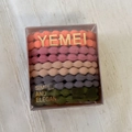Detailed macro of five high-elasticity wave textured hair ties in a clear storage box - Braided Colorful Series